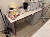 a table with a microwave and a blender on it