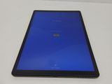 an image of a tablet computer sitting on top of a white table
