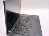 a laptop that is open on a white surface