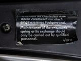 a close up of a label on a car door handle