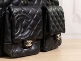a black purse that is sitting on a table