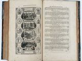 an open book with a picture of a city in it