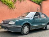 a blue car parked on the side of the road