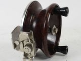 an image of a wooden spinning machine on a white surface