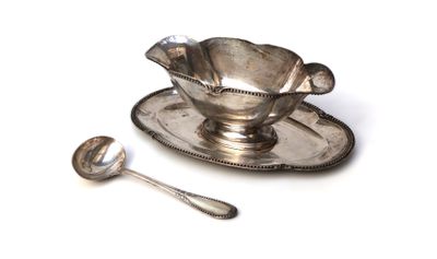 a silver plate with a spoon on it and a spoon on the plate