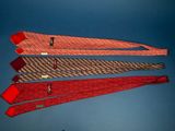 three ties with different designs on them against a blue sky