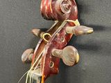 a violin made out of a violin string and a piece of wood
