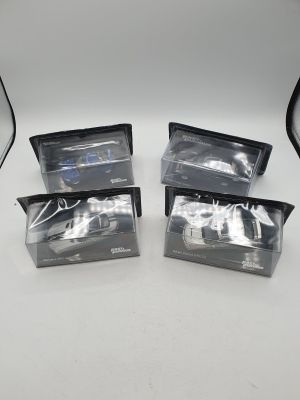 three black plastic bags with a car in them sitting on a table