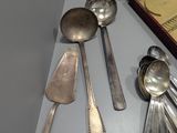 a lot of silver spoons and spoon spoons on a table