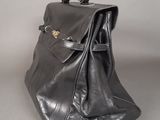 grey leather backpack on a grey background