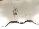 a white plate with writing on it sitting on a table