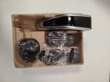 a box with a remote and other items inside of it