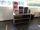 an image of a room with a lot of microwaves on the counter