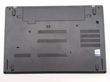 a black laptop that is sitting on a white surface
