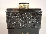 an image of a black box with a gold ring on top of it