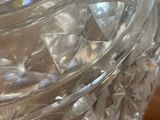 a clear glass vase with a clear lid on a table