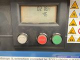 a close up of a parking meter with a clock on it