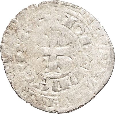 a close up of a coin with a face on it