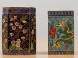 two small tins that are sitting on a table
