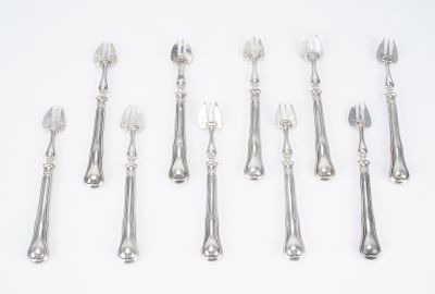 a lot of forks and spoons on the table