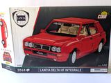 a box with a model of a red car in it