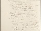 an old document with writing on it sitting on top of a table
