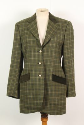 une photo d'une veste verte et noire sur un mannequin