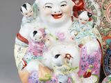 several porcelain figurines and a bowl are sitting next to each other