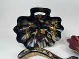 two decorative items that are sitting on a table
