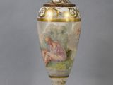 a lamp that has a painting on it on it