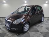 a picture of a brown car parked in a garage