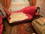 a couch with a pillow on it in a living room