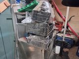 a lot of clutter on the floor of this garage