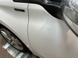 a close up of a car with a denting on it