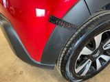 a close up of a car tire with a sticker on it