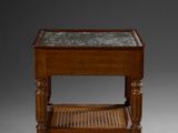 an old wooden table with a glass top and a wicker shelf
