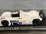 a white model of a race car in a display case