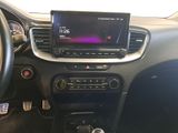 the dashboard of a car with a radio and a steering wheel