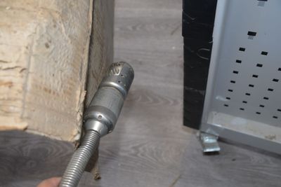 a person that is holding a hose in their hand