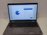 an open laptop computer sitting on top of a white table