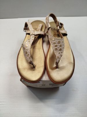 the shoes are on the box and ready to be put into the box
