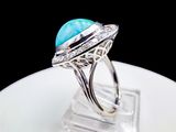 sterling silver ring with a turquoise stone and diamonds
