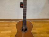 a guitar that is sitting on a stand on the floor