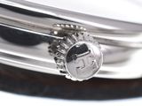 a close up of a watch on a table