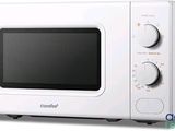 a white microwave oven sitting on a white surface