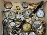 a box full of assorted watches and other items