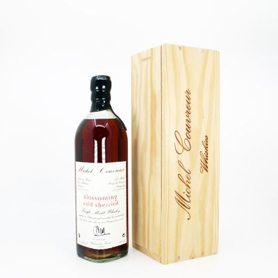 an image of a bottle of whiskey next to a wooden box