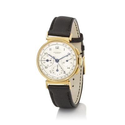 a close up of a watch on a white surface with a white background