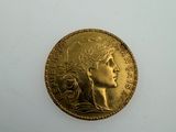 an image of a gold coin with a woman ' s face on it