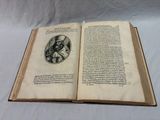 an open book with a picture of a man on it